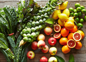a group of fruits and vegetables on a wood surface Healthy Weight Loss Diets Aylesbury
