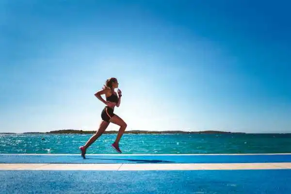 Woman running showing strong leg muscle Aylesbury